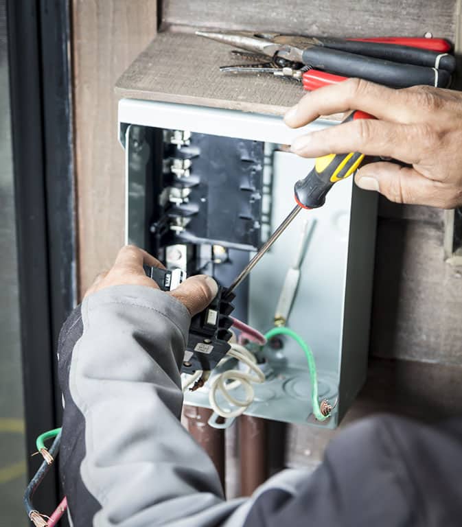 Installing circuit breaker in Colorado Springs home by Basset